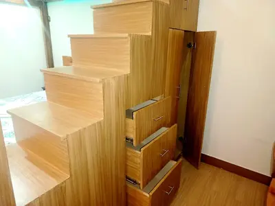 a closet with wooden shelves and drawers in a room at Happy Stays C - 300mbps - 65