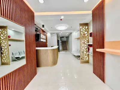 a dressing room with wood paneling and a hallway at OYO 1045 Rayjan Apartelle in Manila