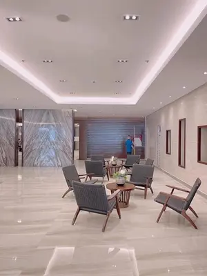 a lobby with chairs and a table in a building at Manila Bay Retreat at Soleil Suite in Manila
