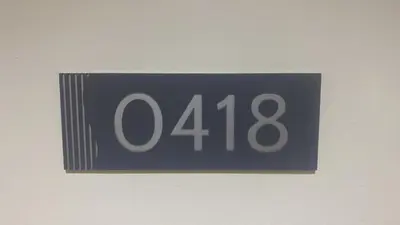 a blue sign with the number on a wall at Ella’s Condo@Shore3 T3 in Manila