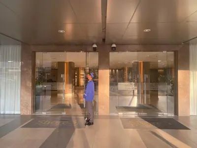 a man standing in the middle of a building at Ella’s Condo@Shore3 T3 in Manila