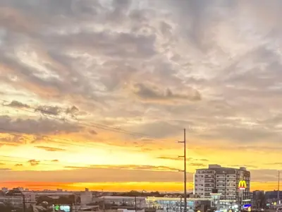 a city skyline with a cloudy sky at sunset at Modern style 2BR Condo Good for 6 Packs Near NAIA in Manila