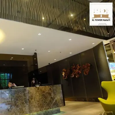 a lobby with a counter and a sign that reads at tower market at Muji KLTower Makati - Greenbelt - with Pool Access in Manila