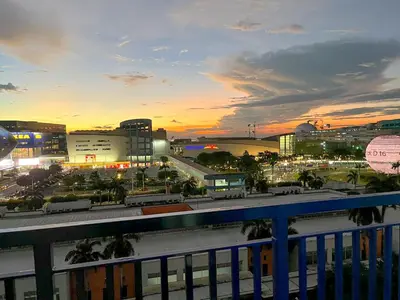 a view of a city at sunset with traffic at Madison Place at Sea Residences powered by Cocotel in Manila