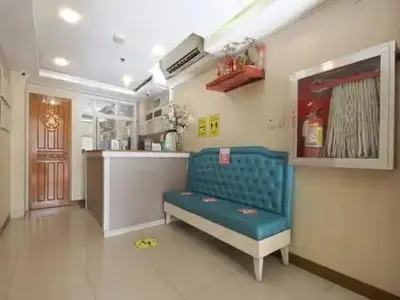 a room with a blue bench in a kitchen at Freemont Place in Manila