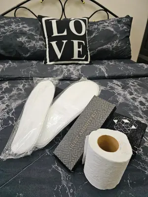 a bed with a roll of toilet paper on it at Athena's Place - Hope Residences SMDC Trece Cavite in Trece Martires