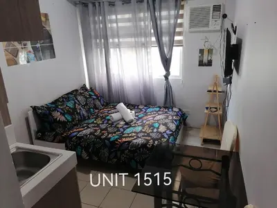 a small room with a bed and a window at Para Sa'yo in Manila