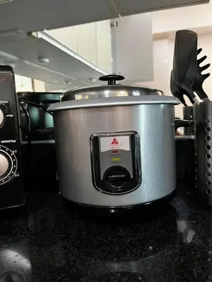 a large pot sitting on top of a kitchen counter at The Beacon Condo (1BR Unit) in Manila