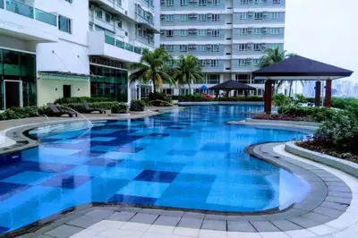a swimming pool in the middle of a building at The Beacon Condo - Studio Tower 1 in Manila