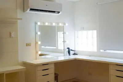 a bathroom with a large mirror and a sink at Makati Altean Apartment (Maura Room) in Manila
