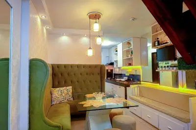a living room with a couch and a table at House of Citiflora Unit B in Manila