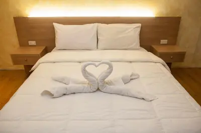 two swans making a heart on a bed at Melbourne makati in Manila