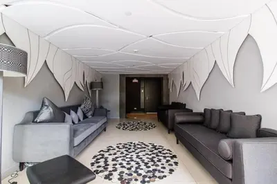 a living room with two couches and a rug at Simple Yet Lovely 2BR Unit in Acqua Private Residences in Manila