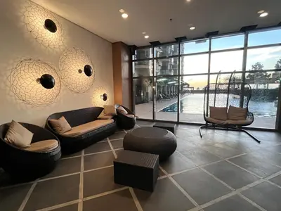 a living room with a couch and a swing at Bayview near PICC CCP starcity OKADA Airport MOA in Manila