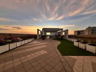 a view of a building with a sunset in the background at Bayview near PICC CCP starcity OKADA Airport MOA in Manila