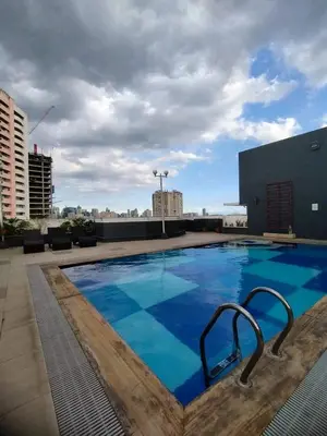 a large swimming pool on the roof of a building at Yuanhang 1508 in Manila