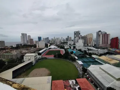 an aerial view of a city with a baseball field at Yuanhang 1508 in Manila