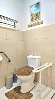 a bathroom with a toilet in a room at Guest Favorite House in Biñan in Biñan