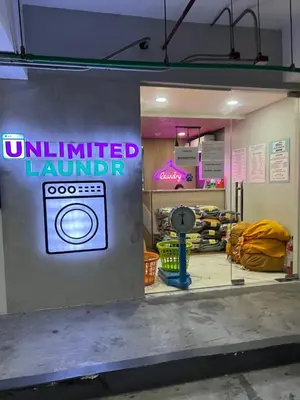 a room with a sign that reads unlimited laundry at Family suite by SMDC fame residence 5 mins to Shaw mrt,megamall,ortigas in Manila