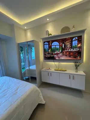 a bedroom with a large mirror on the wall at Luxury lodgings by PN Leonardo in Manila