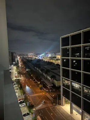 a view of a city at night from a building at Katrina Suite infront of Mall of Asia and Bay area in Manila