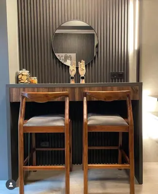 a dressing table with two chairs and a mirror at SATELUXXE CAVE SHORE 3 in Manila