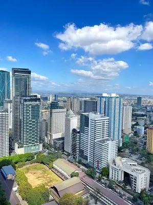 an aerial view of a city with tall buildings at 2 Bedroom Loft at Twin Oaks Place in Manila