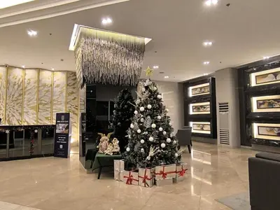 a christmas tree in the middle of a store at Fame Residence 701 Tower 2 in Manila