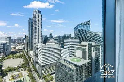 a view of a city skyline with tall buildings at Tropical Oasis w/ the best view of BGC + Netflix in Manila