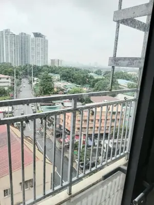a view of a city street from a balcony at Centro Tower - 2 Bedroom Fully Furnished in Manila