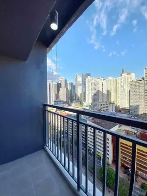 a balcony with a view of the city at Avery's Place at SMDC RED RES. in Manila