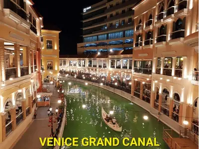avenue grand canal in a shopping mall at night at Modern Condo At Venice Residences Bgc #vlrb29k in Manila