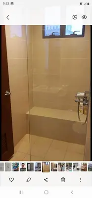 a bathroom with a shower with a glass door at Grand Canal Penthouse! in Manila