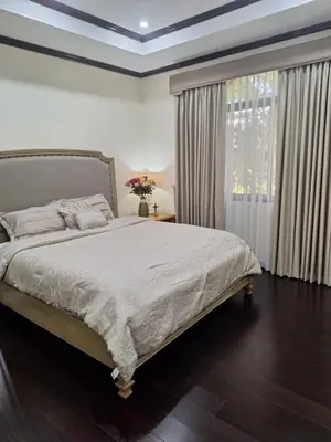 a bedroom with a large bed and a window at La Dolce Vita Villa in Santa Rosa
