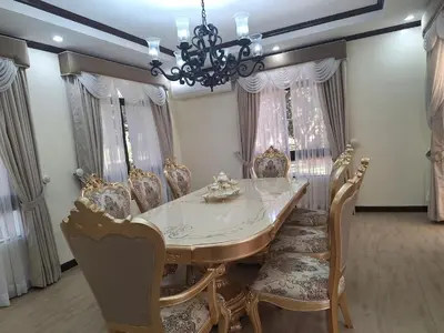 a dining room with a table and chairs and a chandelier at La Dolce Vita Villa in Santa Rosa