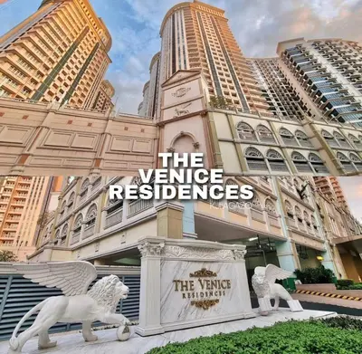 a building with two white statues in front of it at Luxury Bgc Condo Near Venice Mall #vlra22e in Manila