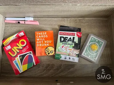 a drawer filled with different types of snacks and games at SMG - Studio@Green2: Wi-fi, Netflix, Swim & Relax in Cavite
