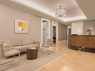 a living room with a couch and a table at Discovery Primea in Manila