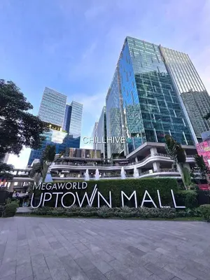 a sign in front of a large building at Premium Bgc Staycation, Uptown Area #ournw27b in Manila