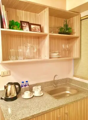a kitchen with a sink and a counter top at Romantic 2BR Condo unit with free WiFi in Anabu Primero