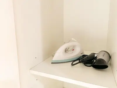 a telephone sitting on a shelf in a room at Upscale Bgc Experience 1br Condo #oursw17c2 in Manila