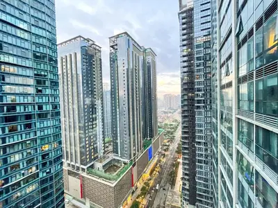an aerial view of a city with tall buildings at Bgc Staycation Across Uptown Mall #oursw29f in Manila