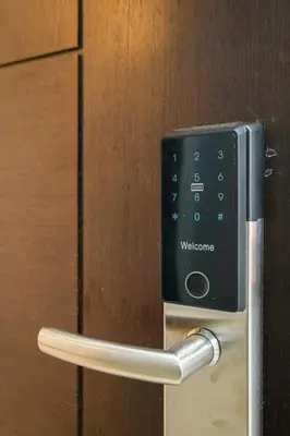 a door opener with a door handle on a door at BGC 2BR Uptown Parksuites with balcony and bathtub in Manila