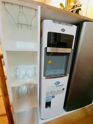 a refrigerator with its door open in a kitchen at Serenity in Style: Scandinavian Zen in Nuvali in Pitland