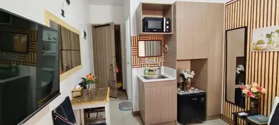 a small bathroom with a sink and a microwave at JJMC HOMESTAY 32 With Netflix and Unli Wifi in Manila