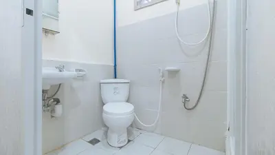 a bathroom with a toilet and a sink at RedDoorz @ Western Bicutan Transients Inn in Manila