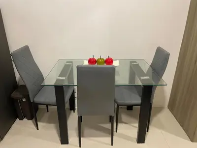 a glass table with two apples on top of it at Fame Residences Pool View near MRT, Shaw, Megamall & Ortigas 1026 in Manila