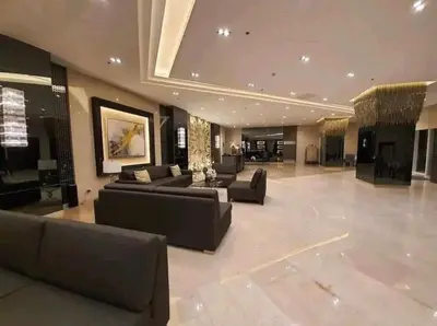 a large living room with couches and a table at Fame Residences Pool View near MRT, Shaw, Megamall & Ortigas 1026 in Manila