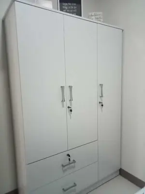a white cabinet with four knobs on it at Free Wi-Fi Luxurious Haven by the Bay - 2BR Near MOA PICC CCP in Manila