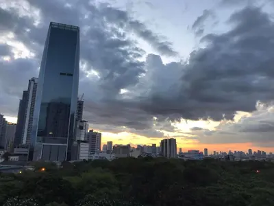 a skyline of a city with a tall building at 5 minutes to Jazz Mall! Studio-type condo 100mbps in Manila